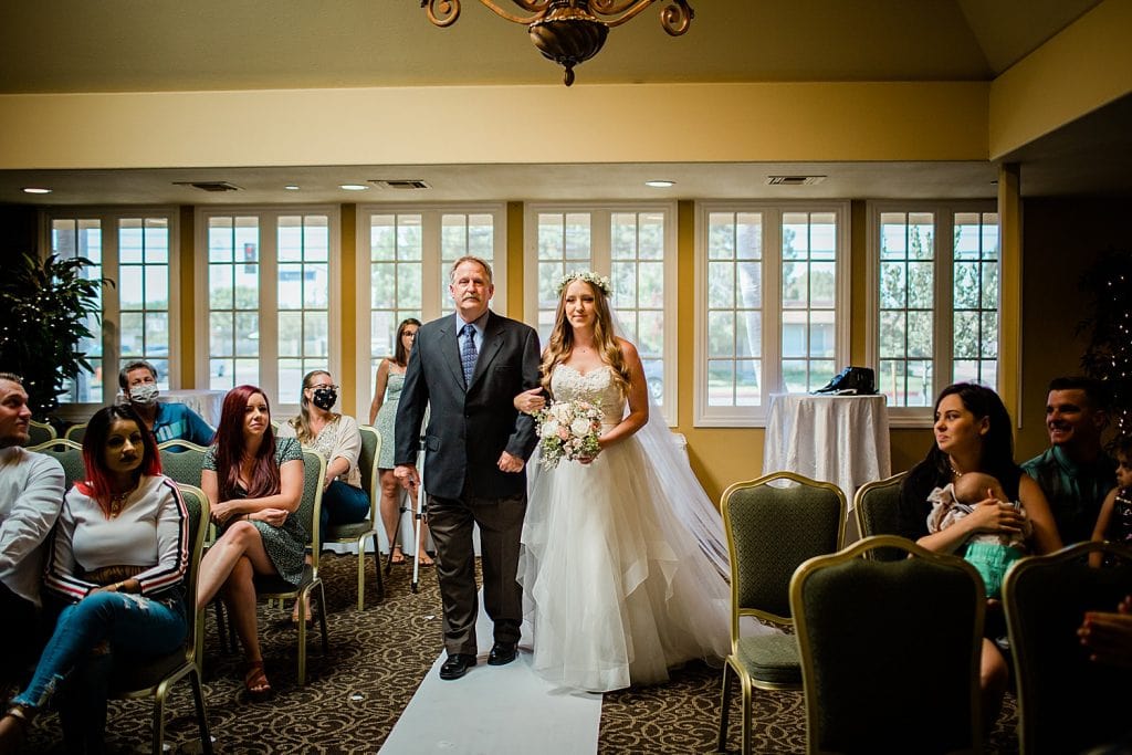 bride walking up aisle a wedding the villa