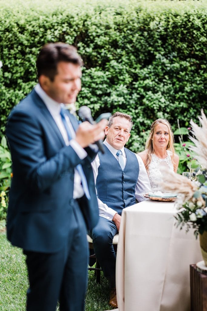 Son of the bride singing at wedding