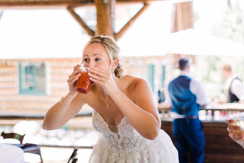 Drinking in wedding dress