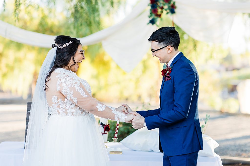 Laughing bride and groom