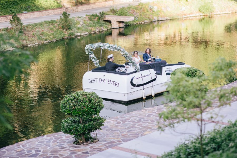 Bride and groom on boat at los willows