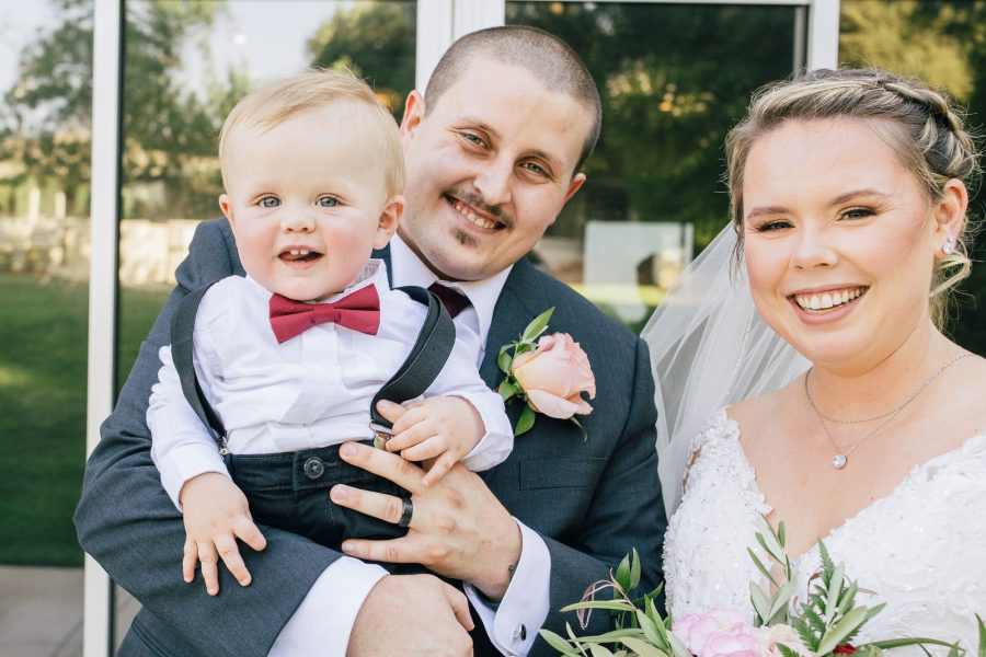 bride and groom and son