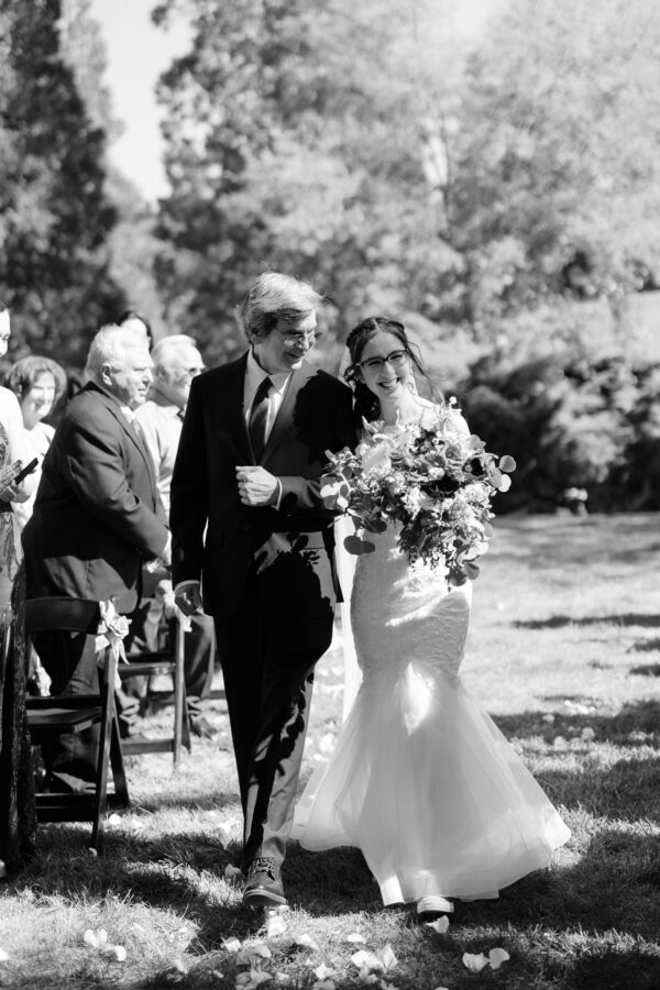 Bride walking up the aisle san mortiz lodge wedding