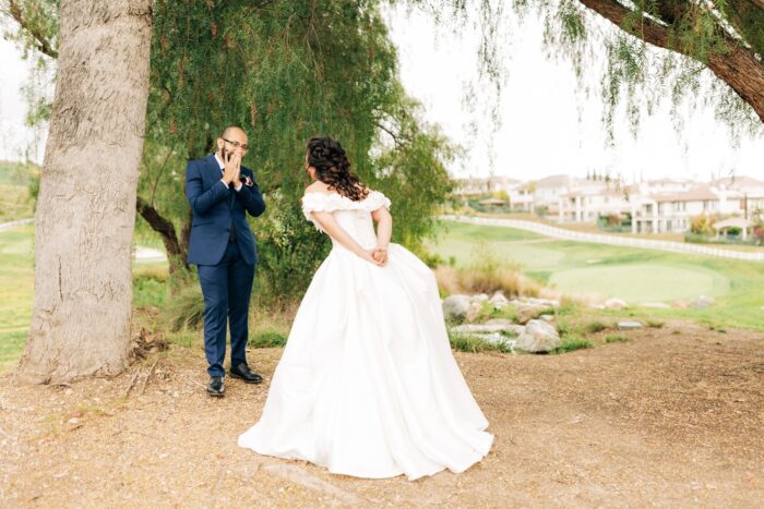 Black and gold spring wedding first look