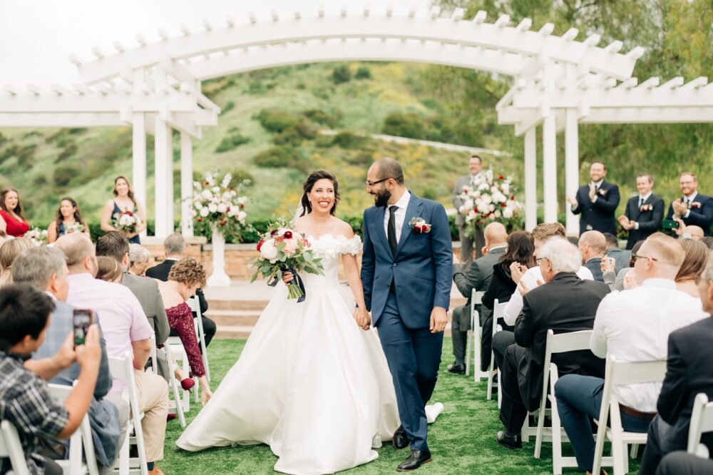 Black and gold spring wedding bride and groom