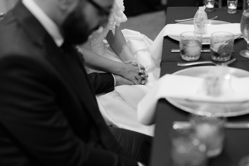 Bride and groom holding hands