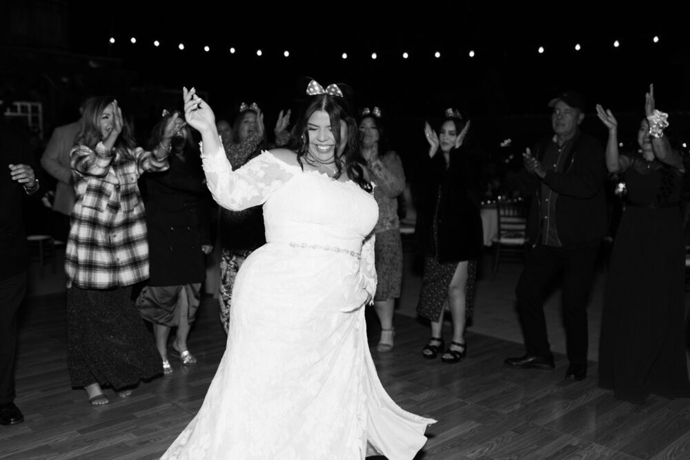 Bride dancing at spring wedding at the homestead in oak glen